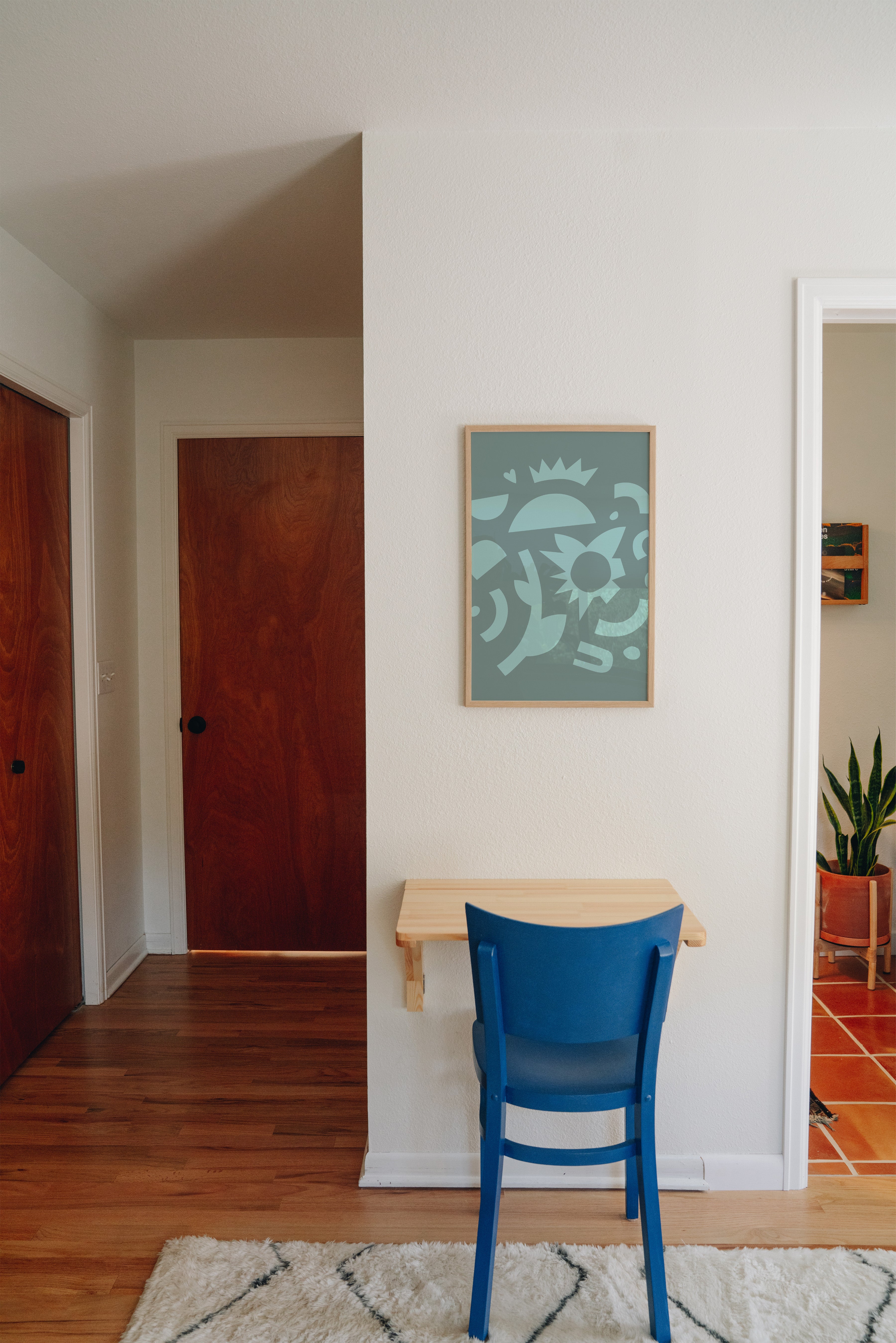 Thorny geometric cactus print displayed in modern home office above desk, teal wall art styling inspiration